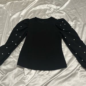 Black long sleeve with pearl accents on sleeves